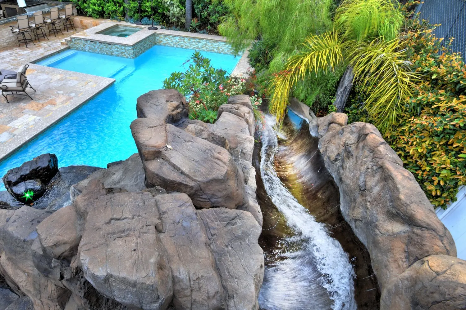 Remodeled pool with rock waterfall